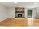 Spacious living room featuring a stone fireplace and sliding glass doors to a deck at 460 27Th Avenue Nw Cir, Hickory, NC 28601