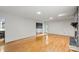 Open living area with hardwood floors and a decorative stone fireplace at 460 27Th Avenue Nw Cir, Hickory, NC 28601