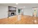 Open living room with beautiful hardwood floors and stone fireplace at 460 27Th Avenue Nw Cir, Hickory, NC 28601