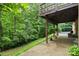 A serene outdoor space with a partially covered patio offering views of lush greenery at 460 27Th Avenue Nw Cir, Hickory, NC 28601