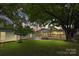 A nicely manicured backyard that is perfect for entertaining on the wooden deck or yard games at 4838 Keats Ave, Charlotte, NC 28212