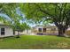 A nicely manicured backyard that is perfect for entertaining on the wooden deck or yard games at 4838 Keats Ave, Charlotte, NC 28212
