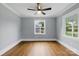 This bedroom features hardwood floors, natural light, and a ceiling fan, creating a comfortable and inviting space at 4838 Keats Ave, Charlotte, NC 28212