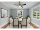 Bright and airy dining room has natural light, modern chandelier, and neutral color scheme at 4838 Keats Ave, Charlotte, NC 28212