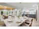 Open concept kitchen and dining room features a large marble table and stainless steel appliances at 4838 Keats Ave, Charlotte, NC 28212