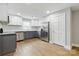Well-lit kitchen boasts stainless steel appliances, two-tone cabinets and granite countertops, ideal for cooking and entertaining at 4838 Keats Ave, Charlotte, NC 28212