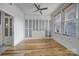 Bright bedroom with wood floors, ceiling fan, and custom wardrobe at 515 N Church St # 305, Charlotte, NC 28202