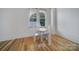 Cozy dining area with a window view and natural light, featuring hardwood floors at 515 N Church St # 305, Charlotte, NC 28202