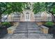 A brick staircase leads to a secure entry to the brick apartment building at 515 N Church St # 305, Charlotte, NC 28202