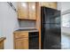 Kitchen showcases light wood cabinets and black appliances, including a dishwasher and refrigerator at 515 N Church St # 305, Charlotte, NC 28202