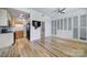 Open-concept layout with updated kitchen, wood floors, and a TV mount at 515 N Church St # 305, Charlotte, NC 28202