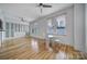 Bright room featuring wood floors, a dining table, and built-in cabinets at 515 N Church St # 305, Charlotte, NC 28202