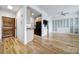 Open floor plan with hardwood floors, ample storage and a glimpse into the kitchen at 515 N Church St # 305, Charlotte, NC 28202
