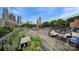 Wide rooftop patio with outdoor seating, garden area and umbrella, boasting city skyline view at 515 N Church St # 305, Charlotte, NC 28202