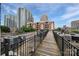 Rooftop with wooden pathway surrounded by AC units and city buildings at 515 N Church St # 305, Charlotte, NC 28202