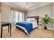 Bedroom features natural light, neutral paint, and bedside tables at 5518 Morris Hunt Dr, Fort Mill, SC 29708