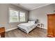Cozy bedroom with hardwood floors and bright window with neighborhood views at 5518 Morris Hunt Dr, Fort Mill, SC 29708