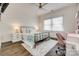 Bright bedroom featuring ceiling fan and natural light at 5518 Morris Hunt Dr, Fort Mill, SC 29708