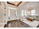 Elegant foyer showcasing hardwood floors, decorative lighting, and an inviting view into the living room at 5518 Morris Hunt Dr, Fort Mill, SC 29708