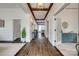 Hallway with hardwood floors, elegant lighting, and an open view to other rooms at 5518 Morris Hunt Dr, Fort Mill, SC 29708