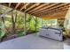 Outdoor hot tub on a concrete patio, offering a tranquil retreat in a wooded setting at 5518 Morris Hunt Dr, Fort Mill, SC 29708