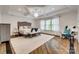 Spacious main bedroom with tray ceilings, lots of natural light and hardwood floors at 5518 Morris Hunt Dr, Fort Mill, SC 29708
