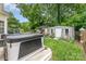 Backyard with a hot tub, shed, and covered gazebo for outdoor relaxation and entertainment at 5829 Andrew Ward Ave, Charlotte, NC 28216