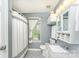 Clean bathroom featuring a shower with a curtain, vanity with granite countertop, and neutral decor at 5829 Andrew Ward Ave, Charlotte, NC 28216