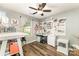 Craft bedroom with ceiling fan, wood flooring, window with natural light and craft organization at 5829 Andrew Ward Ave, Charlotte, NC 28216