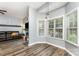 Cozy breakfast nook with large windows offering views of the outdoors, seamlessly connected to the living area at 5829 Andrew Ward Ave, Charlotte, NC 28216