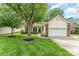 Charming home featuring brick accents, a well-manicured lawn, and a tree-shaded front yard at 5829 Andrew Ward Ave, Charlotte, NC 28216