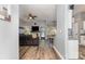 Open-concept living room featuring stylish floors, a fireplace with TV, and a seamless transition to the kitchen at 5829 Andrew Ward Ave, Charlotte, NC 28216