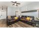 Spacious living room featuring two comfortable leather sofas and stylish decor at 5829 Andrew Ward Ave, Charlotte, NC 28216