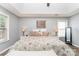 Bright main bedroom with a trey ceiling, stylish decor, and ample natural light at 5829 Andrew Ward Ave, Charlotte, NC 28216