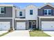 Charming townhouse featuring gray siding, a one-car garage, and a welcoming front entrance at 6110 Starview Ter, Charlotte, NC 28216