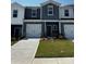 Charming new construction townhome featuring a one-car garage and beautifully landscaped front yard at 6118 Starview Ter, Charlotte, NC 28216