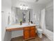 Bathroom features an extended vanity with plenty of storage space, as well as a shower-tub combo at 6532 Prosperity Commons Dr, Charlotte, NC 28269