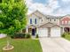 Charming two-story home with a stone facade and a well-manicured front yard at 6532 Prosperity Commons Dr, Charlotte, NC 28269