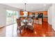 Eat-in kitchen with wood cabinets, stainless appliances, and access to the backyard at 6532 Prosperity Commons Dr, Charlotte, NC 28269