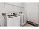 Convenient laundry room has a washer, dryer, and overhead shelving for storage at 6532 Prosperity Commons Dr, Charlotte, NC 28269