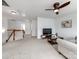 Bright living room with a ceiling fan, plush carpeting, and cozy seating area at 6532 Prosperity Commons Dr, Charlotte, NC 28269