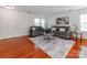 Tastefully decorated living room featuring hardwood floors, modern sofas, and stylish decor at 6532 Prosperity Commons Dr, Charlotte, NC 28269