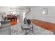 Open-concept living area with hardwood floors, connected to the dining area and staircase at 6532 Prosperity Commons Dr, Charlotte, NC 28269