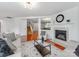 Bright living room features hardwood floors, fireplace, and open staircase at 6532 Prosperity Commons Dr, Charlotte, NC 28269