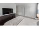 Spacious bedroom with sliding door closet, offers a serene space with ample storage at 6532 Prosperity Commons Dr, Charlotte, NC 28269