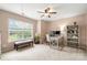 Bright bedroom featuring a ceiling fan, a large window and a desk at 7130 Maricopa Rd, Charlotte, NC 28277