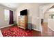 Bedroom with dresser and mounted TV at 7130 Maricopa Rd, Charlotte, NC 28277