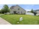 Well-maintained lawn with home's facade showcasing a welcoming entrance and charming exterior at 7130 Maricopa Rd, Charlotte, NC 28277