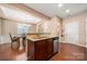 Kitchen with stainless steel appliances and wood cabinets that opens to dining area at 7130 Maricopa Rd, Charlotte, NC 28277