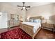 Bright main bedroom with high ceilings, large bed, and dresser at 7130 Maricopa Rd, Charlotte, NC 28277